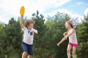 Children enjoying new PE activities such as ultimate frisbee
