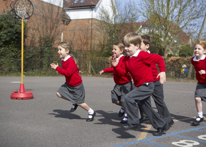 Children undertaking physical activity in a school playground